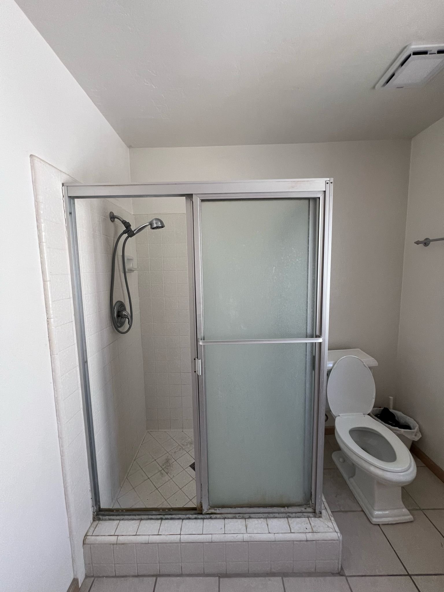 Before reglazing - stained tile wall